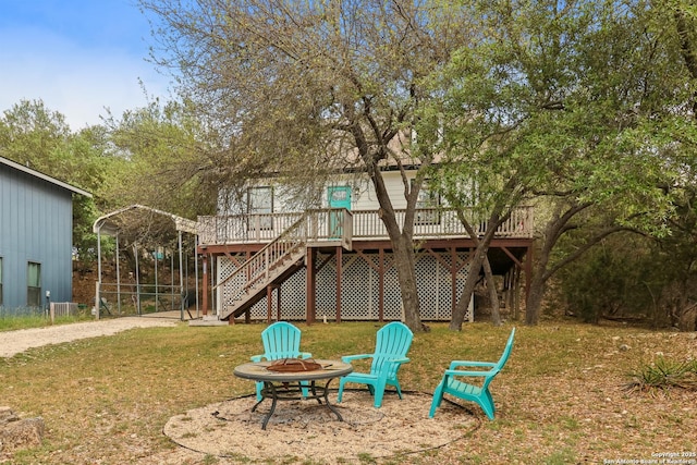 208 Woodridge, Canyon Lake, TX 78133 - exterior space with a lawn, a wooden deck, stairway, and an outdoor fire pit