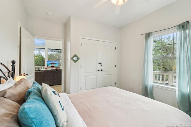 208 Woodridge, Canyon Lake, TX 78133 - bedroom with a ceiling fan, a closet, and multiple windows