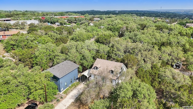 208 Woodridge, Canyon Lake, TX 78133 - drone / aerial view featuring a view of trees