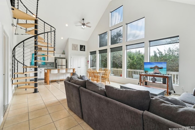 208 Woodridge, Canyon Lake, TX 78133 - living area with high vaulted ceiling, tile patterned floors, stairs, plenty of natural light, and ceiling fan