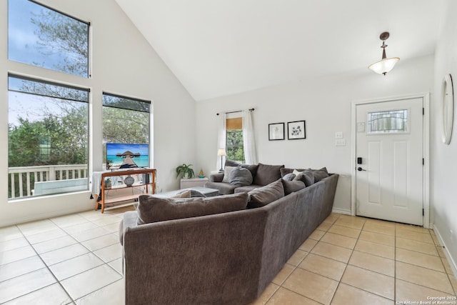 208 Woodridge, Canyon Lake, TX 78133 - living room with high vaulted ceiling, baseboards, and light tile patterned floors