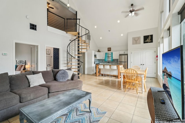 208 Woodridge, Canyon Lake, TX 78133 - living area featuring light tile patterned floors, stairway, high vaulted ceiling, and ceiling fan