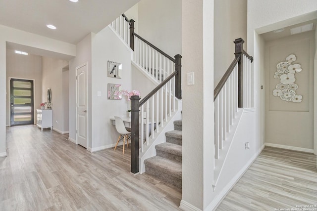 13324 Romulus Way, San Antonio, TX 78245 - stairway with wood finished floors, baseboards, and recessed lighting