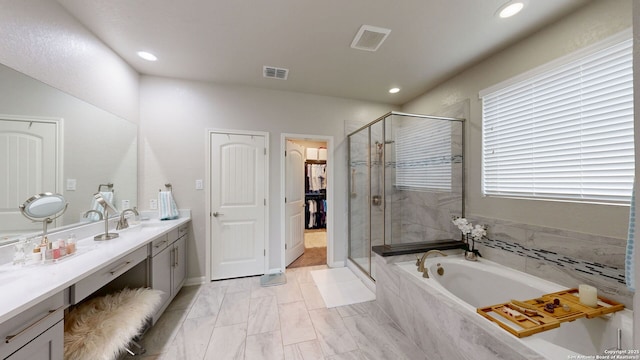 13324 Romulus Way, San Antonio, TX 78245 - bathroom featuring a shower stall, a garden tub, double vanity, recessed lighting, and marble finish flooring