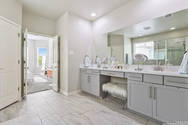 13324 Romulus Way, San Antonio, TX 78245 - full bath with double vanity, a shower stall, baseboards, connected bathroom, and recessed lighting