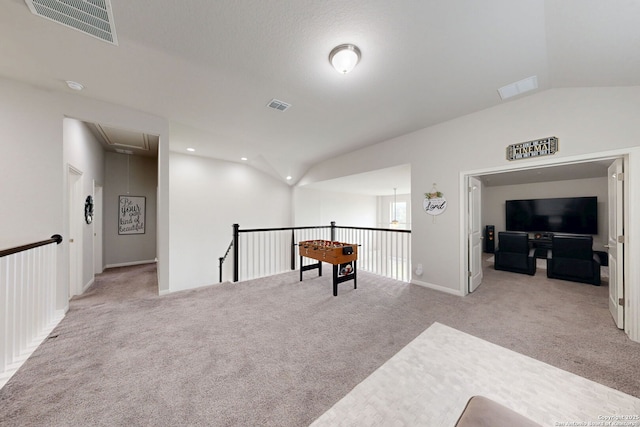 13324 Romulus Way, San Antonio, TX 78245 - living area with attic access, lofted ceiling, carpet floors, baseboards, and an upstairs landing