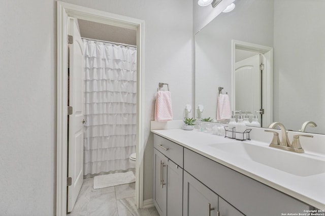 13324 Romulus Way, San Antonio, TX 78245 - full bath with vanity, toilet, and marble look tiles