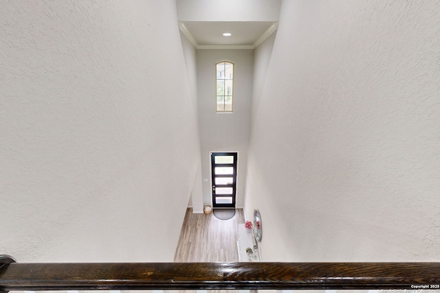 13324 Romulus Way, San Antonio, TX 78245 - stairs featuring ornamental molding, wood finished floors, a textured wall, and baseboards