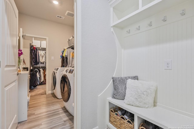 13324 Romulus Way, San Antonio, TX 78245 - laundry area with light wood-style floors, separate washer and dryer, and baseboards