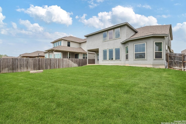 13324 Romulus Way, San Antonio, TX 78245 - rear view of house with stucco siding and roof with shingles