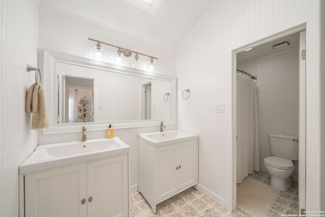bathroom featuring two vanities, visible vents, toilet, and a sink