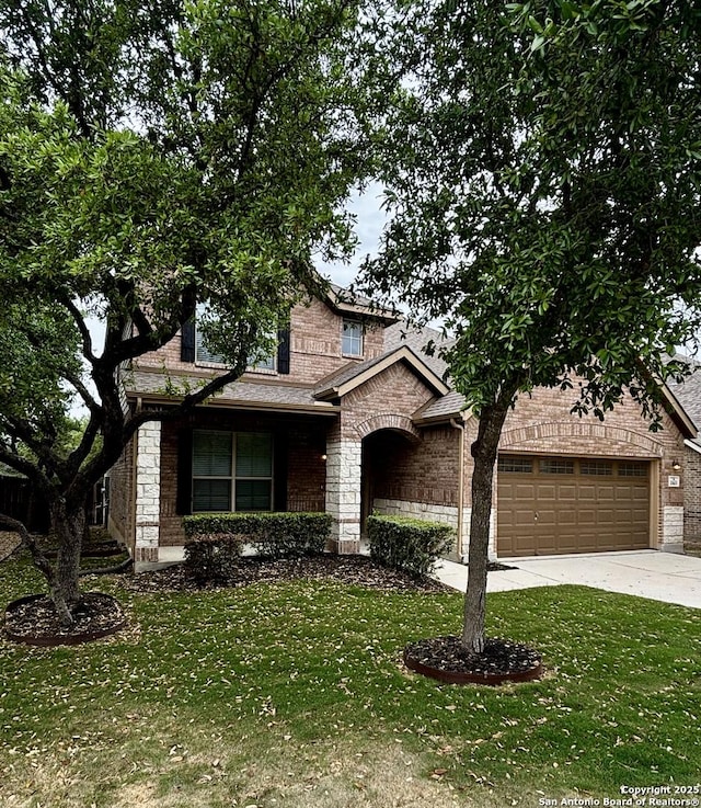 11631 Sangria, San Antonio, TX 78253 - view of front of property with stone siding, a front lawn, brick siding, a garage, and driveway