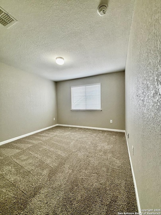 11631 Sangria, San Antonio, TX 78253 - empty room with baseboards, a textured wall, carpet flooring, a textured ceiling, and visible vents