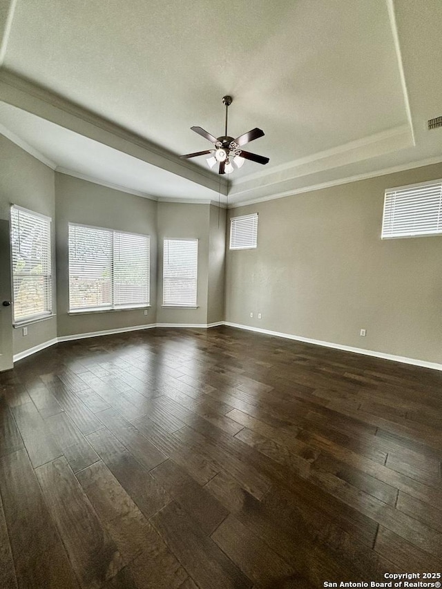 11631 Sangria, San Antonio, TX 78253 - spare room with baseboards, a raised ceiling, ornamental molding, ceiling fan, and dark wood finished floors