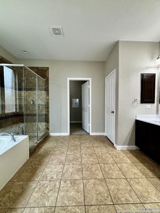 11631 Sangria, San Antonio, TX 78253 - bathroom featuring vanity, baseboards, a shower stall, visible vents, and a garden tub