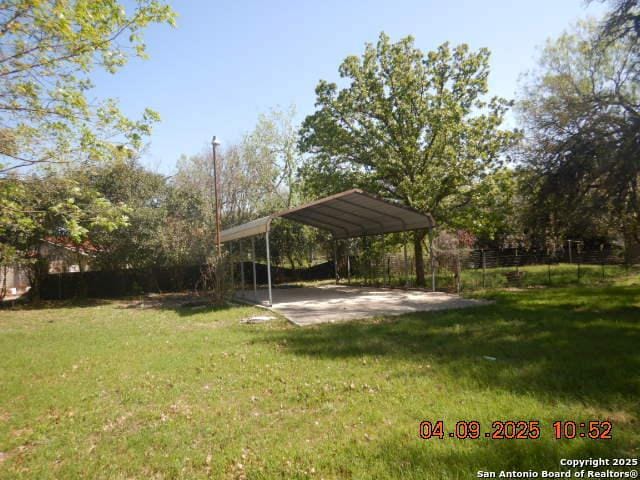 9704 Big Geronimo, San Antonio, TX 78254 - view of yard featuring a detached carport and fence