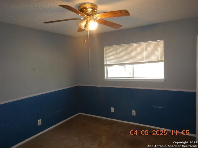 9704 Big Geronimo, San Antonio, TX 78254 - carpeted spare room featuring baseboards and a ceiling fan