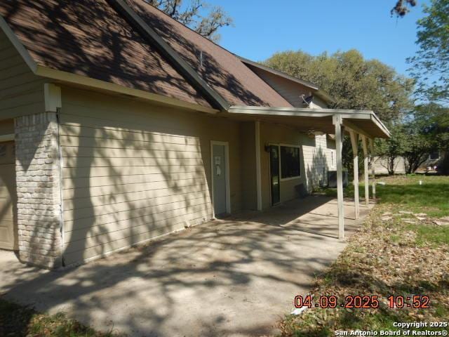 9704 Big Geronimo, San Antonio, TX 78254 - view of side of property featuring a patio