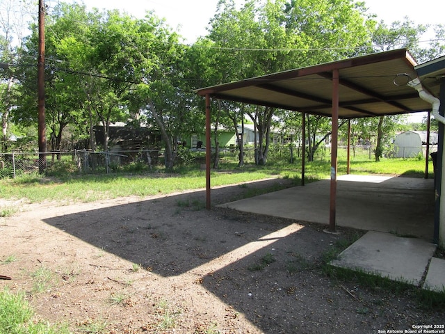 view of yard with fence and a patio