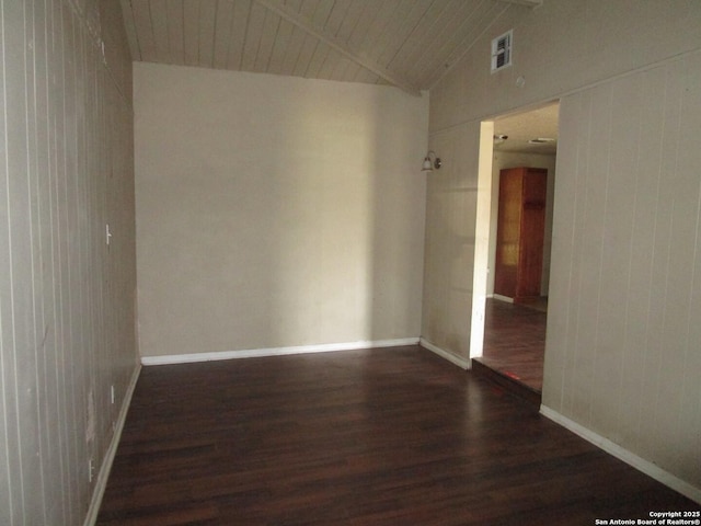 unfurnished room featuring baseboards, vaulted ceiling, visible vents, wooden ceiling, and wood finished floors