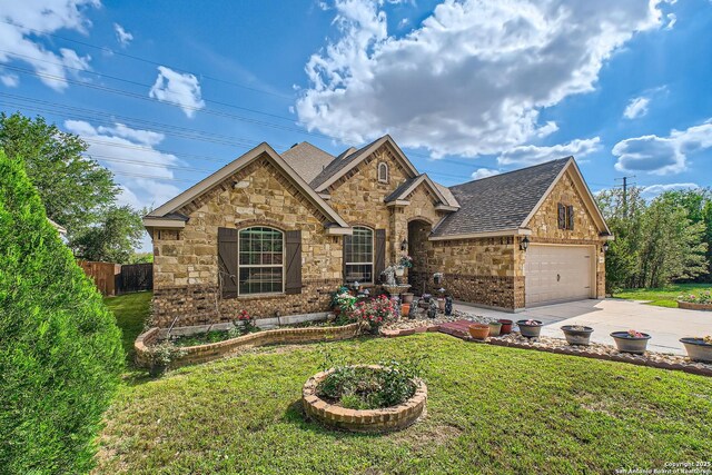 805 Raceland, San Antonio, TX 78245 - view of front of home featuring roof with shingles, driveway, stone siding, a front yard, and a garage