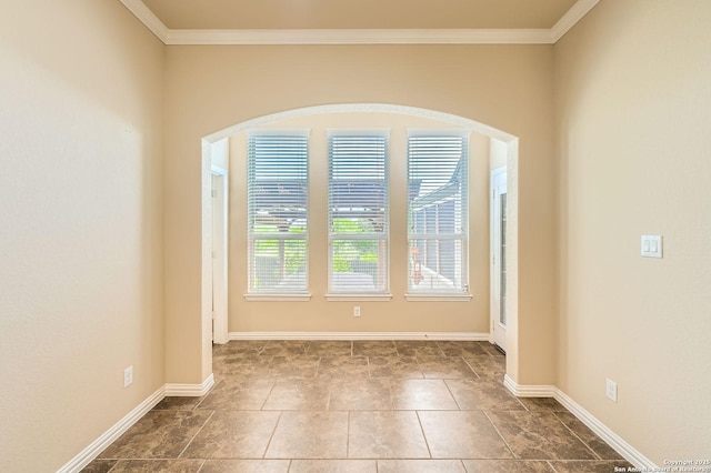 805 Raceland, San Antonio, TX 78245 - empty room featuring crown molding, baseboards, and arched walkways