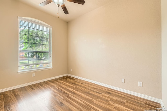 805 Raceland, San Antonio, TX 78245 - empty room featuring baseboards, a ceiling fan, wood finished floors, and a healthy amount of sunlight