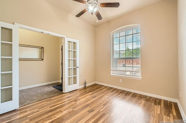 805 Raceland, San Antonio, TX 78245 - empty room with french doors, baseboards, ceiling fan, and wood finished floors