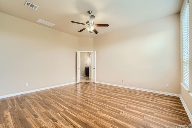 805 Raceland, San Antonio, TX 78245 - unfurnished room with visible vents, light wood-type flooring, baseboards, and ceiling fan