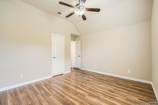 805 Raceland, San Antonio, TX 78245 - unfurnished room featuring visible vents, baseboards, ceiling fan, wood finished floors, and lofted ceiling