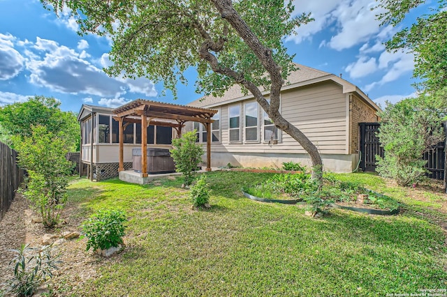 805 Raceland, San Antonio, TX 78245 - rear view of property with a yard, a fenced backyard, a sunroom, and a hot tub
