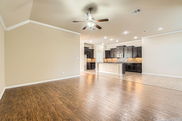 805 Raceland, San Antonio, TX 78245 - unfurnished living room with recessed lighting, a ceiling fan, crown molding, light wood-style floors, and visible vents