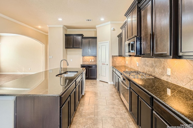 805 Raceland, San Antonio, TX 78245 - kitchen with dark brown cabinetry, ornamental molding, visible vents, appliances with stainless steel finishes, and a sink