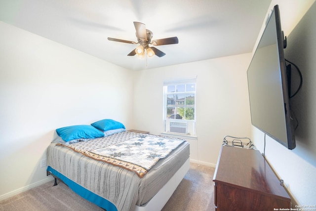 bedroom featuring cooling unit, baseboards, and carpet floors