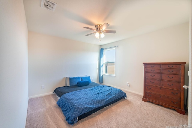 bedroom with light carpet, baseboards, a ceiling fan, and visible vents