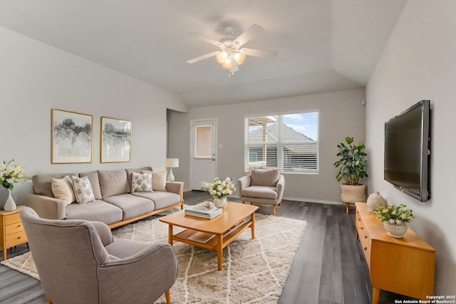 living room with lofted ceiling, baseboards, wood finished floors, and ceiling fan