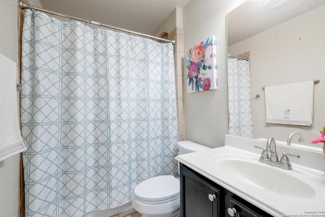 3811 Bacall Way, Converse, TX 78109 - bathroom with toilet, vanity, and curtained shower