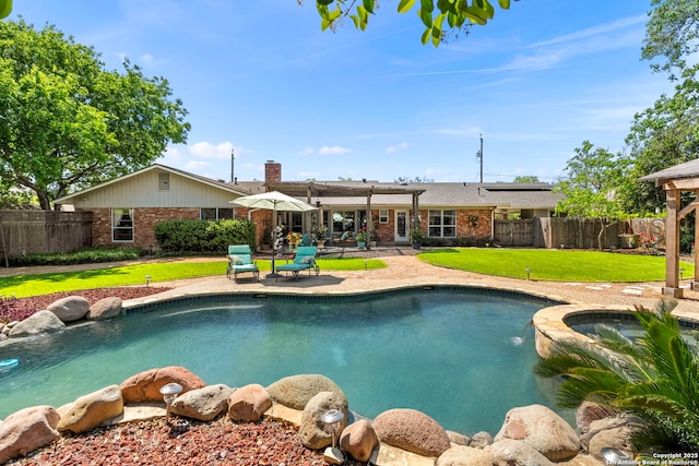 view of pool with a pergola, a yard, a fenced backyard, and a patio