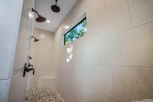 full bath featuring a tile shower