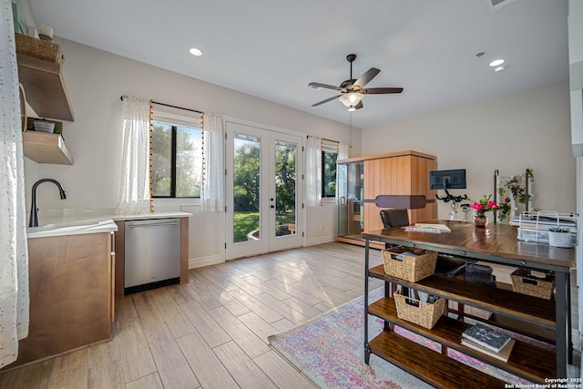 kitchen featuring light wood-type flooring, french doors, open shelves, ceiling fan, and stainless steel dishwasher