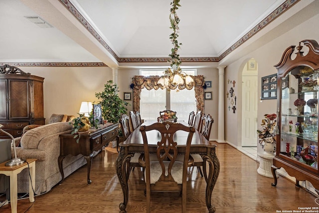 628 Mission Vw, New Braunfels, TX 78130 - dining room featuring light wood-type flooring, visible vents, ornate columns, and an inviting chandelier
