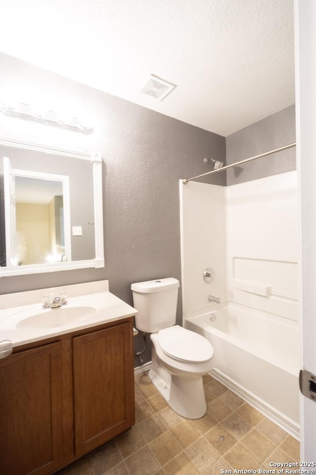 16427 Kentucky, Selma, TX 78154 - bathroom with washtub / shower combination, vanity, a textured wall, toilet, and visible vents