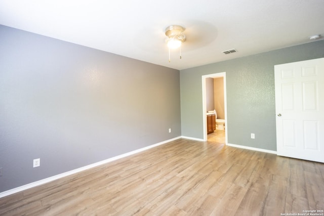 16427 Kentucky, Selma, TX 78154 - unfurnished bedroom with ensuite bathroom, baseboards, visible vents, light wood-type flooring, and a ceiling fan