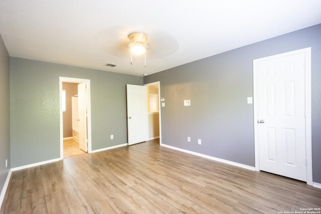 16427 Kentucky, Selma, TX 78154 - unfurnished bedroom featuring connected bathroom, light wood-style flooring, a ceiling fan, visible vents, and baseboards