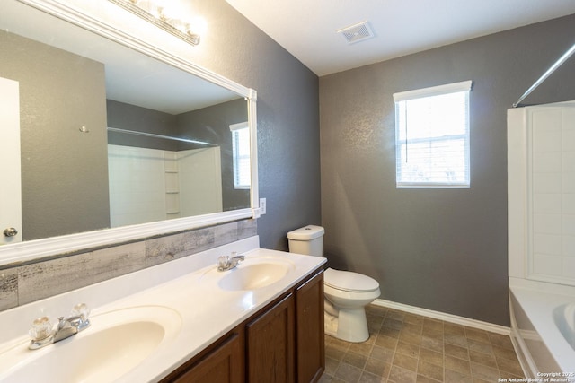 16427 Kentucky, Selma, TX 78154 - full bath with a sink, visible vents, toilet, and a textured wall