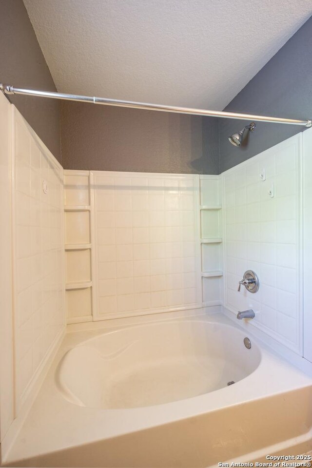 16427 Kentucky, Selma, TX 78154 - full bathroom featuring tub / shower combination and a textured ceiling