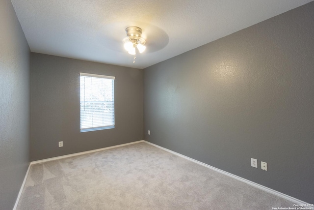 16427 Kentucky, Selma, TX 78154 - unfurnished room featuring carpet, baseboards, and a ceiling fan