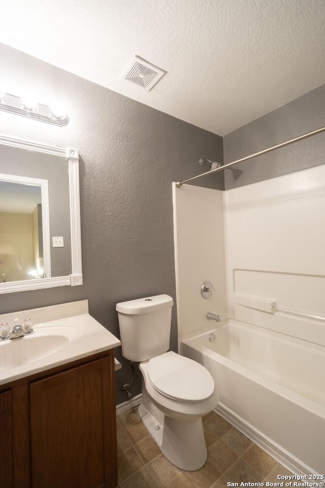 16427 Kentucky, Selma, TX 78154 - full bath with a textured ceiling, vanity, visible vents,  shower combination, and toilet