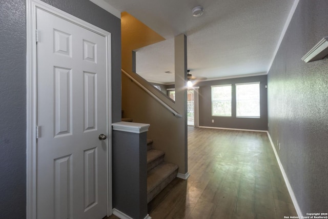 16427 Kentucky, Selma, TX 78154 - stairs with wood finished floors, a textured wall, baseboards, and a ceiling fan