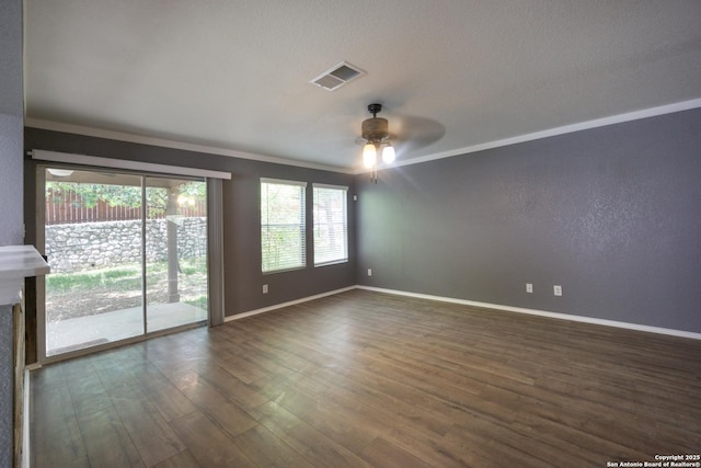16427 Kentucky, Selma, TX 78154 - empty room with crown molding, ceiling fan, dark wood-type flooring, visible vents, and baseboards